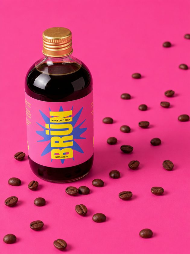 BRÜN Maple bottle surrounded by scattered coffee beans
